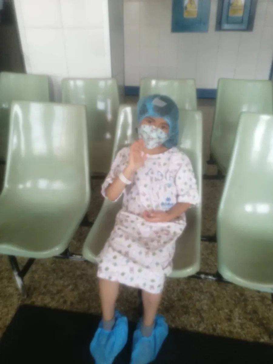 Haviv in a hospital gown during treatment