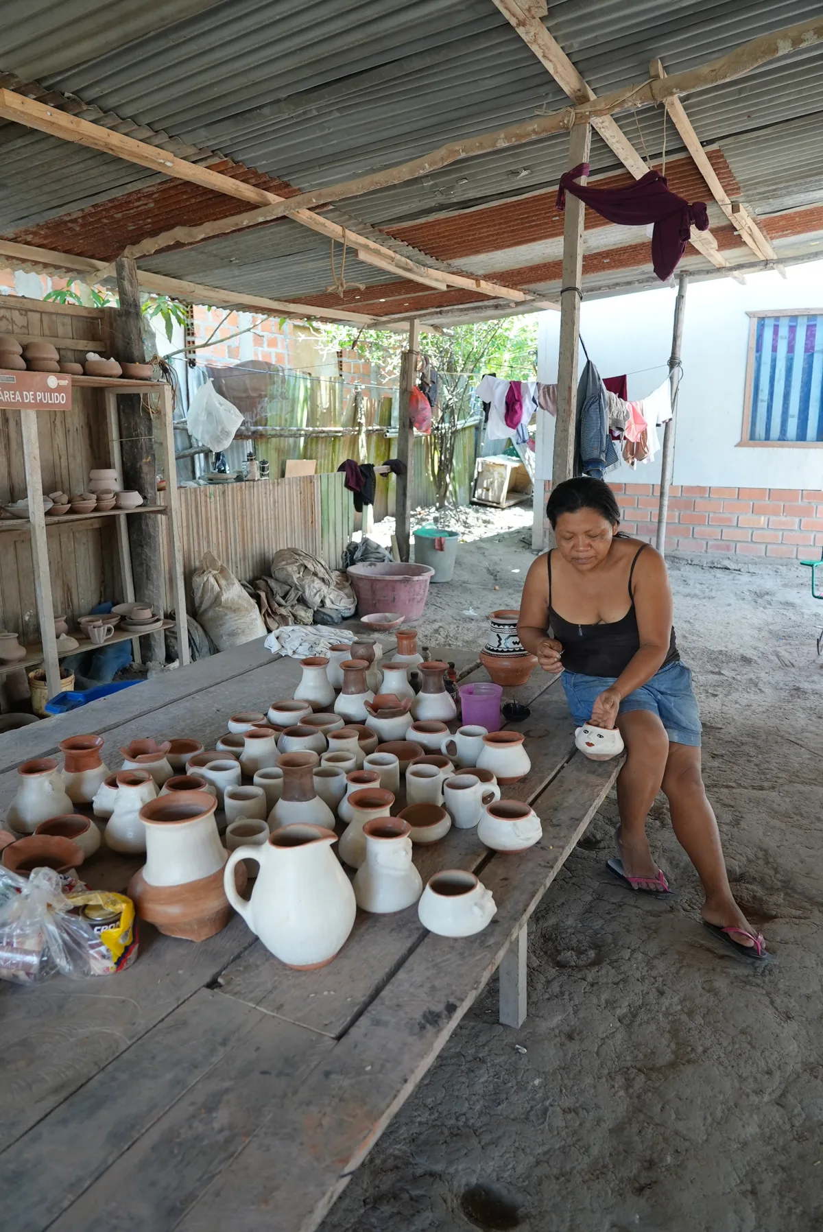 An Amazonian artisan with hand-made ceramics in Peru