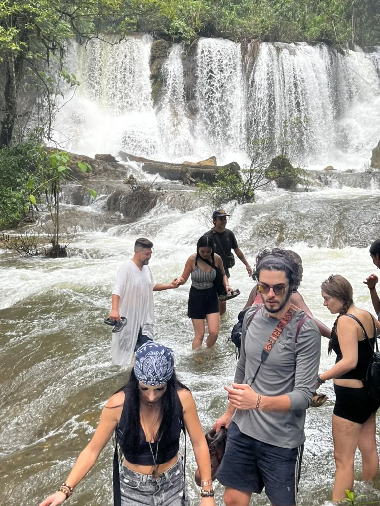 The group crossing a waterfall on the Lacanjá trek